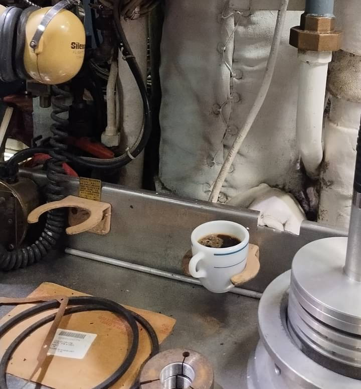 Two examples of zarfs, and a cup of coffee, in the engine room of USS Blueback